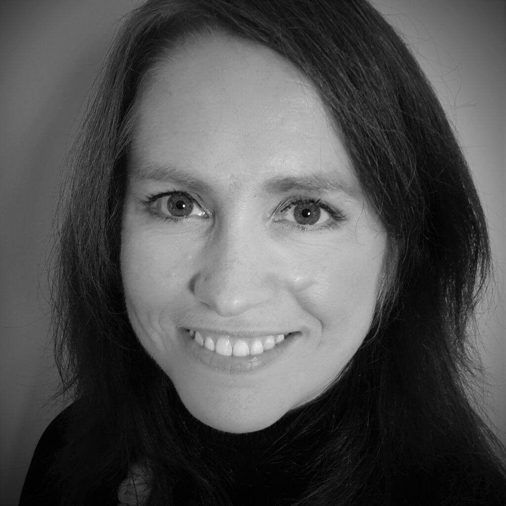 A black and white headshot of author RB Kelly