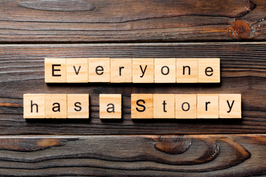scrabble tiles spelling out everyone has a story