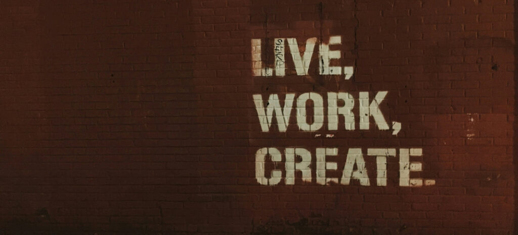 Brick wall painted with LIVE WORK CREATE
