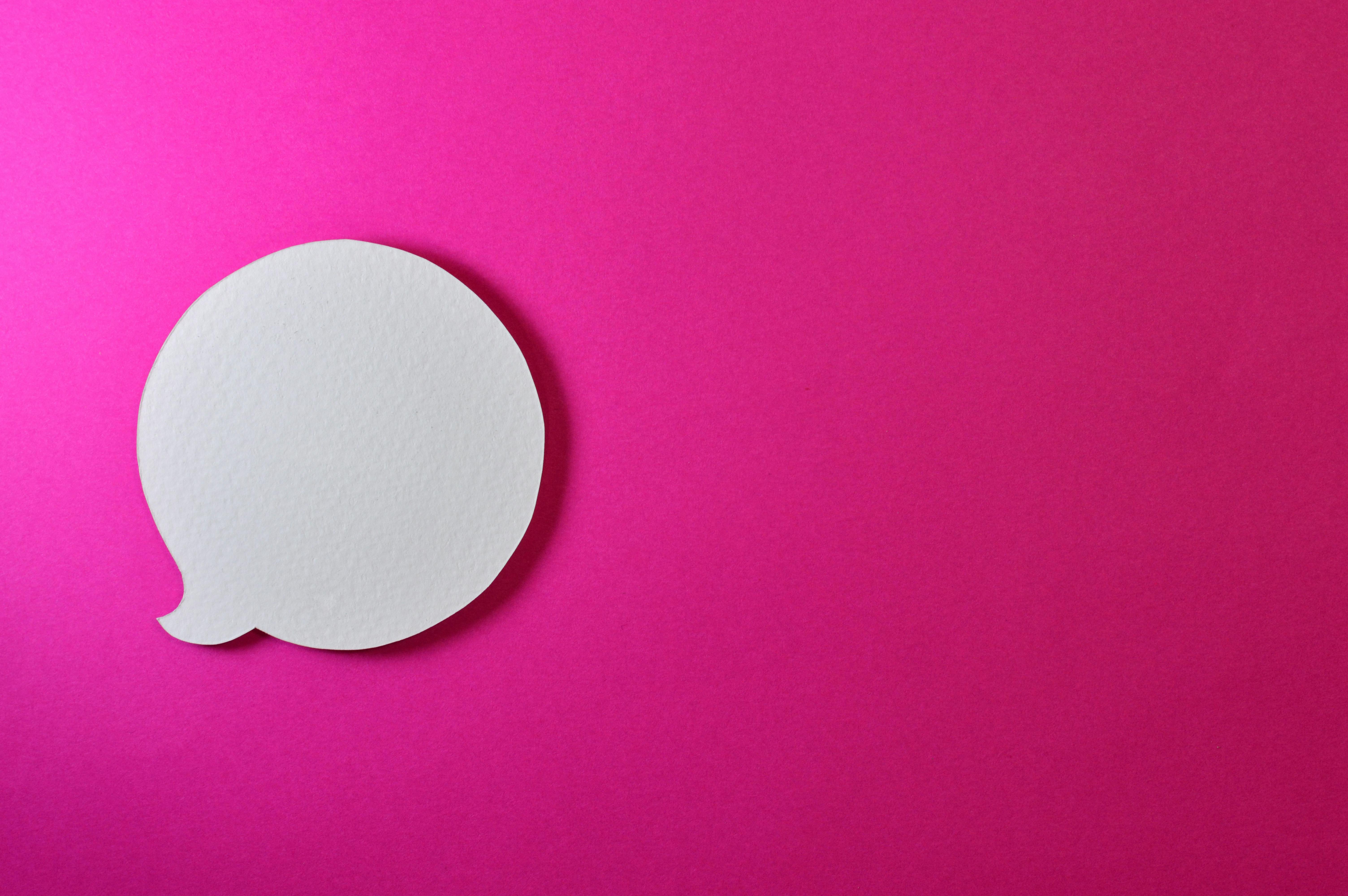 speech bubble on bright pink background
