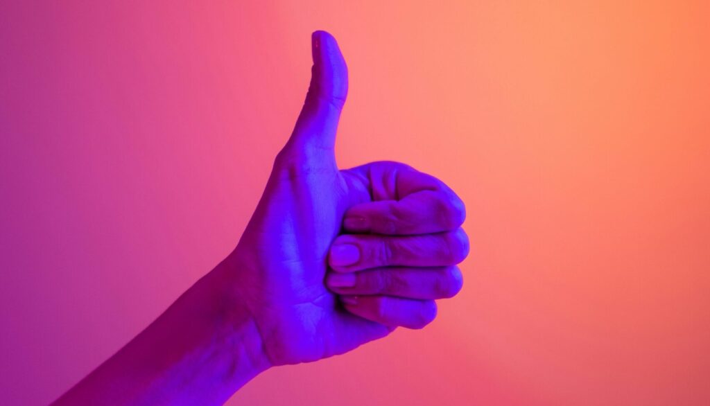 A hand giving the thumbs up gesture