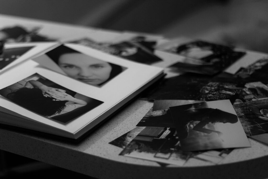 a pile of black and white photographs