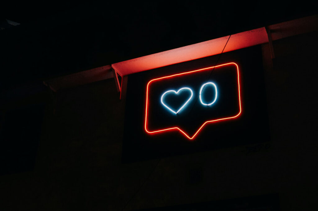 A fluorescent sign with a like symbol