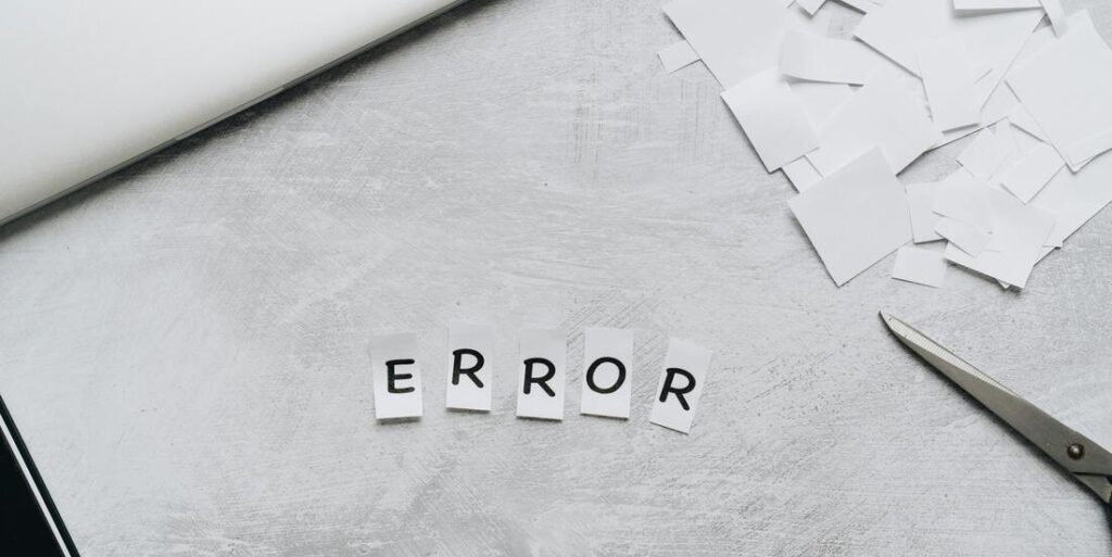 cut out paper letters spelling the word ERROR