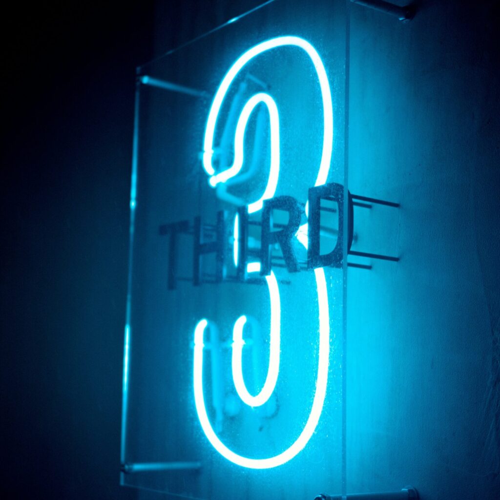 Neon sign of#3 and third