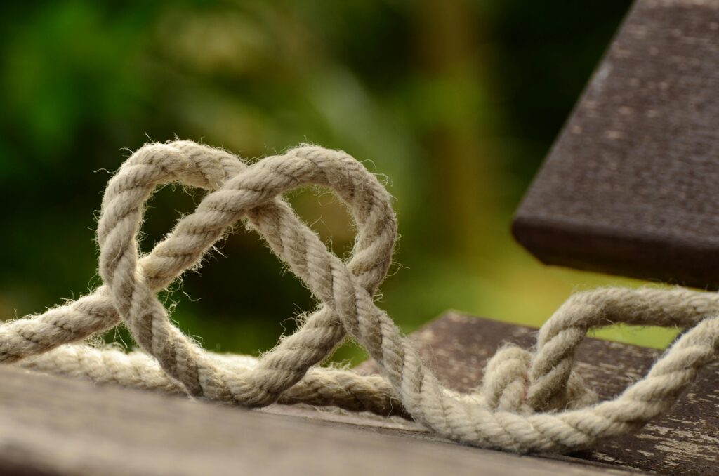 rope knitting heart representing the intertwining visible and invisible narratives in storytelling